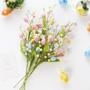 Colorful artificial Easter egg branches with white flowers for festive DIY bouquet decor