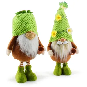 Pair of plush garden gnomes with green knit hats and floral details for home decor