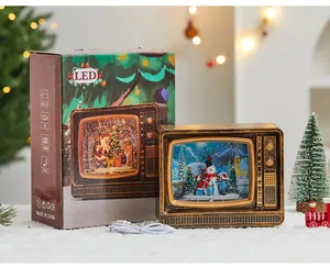 Detailed view of a vintage TV Christmas snow globe with warm LED lighting and USB cable
