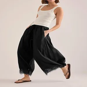 Pantalon noir stylé pour femmes avec taille élastique et ourlet en dentelle fine