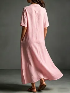 Back view of a loose pink cotton linen maxi dress for women with short sleeves