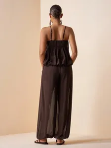 Back view of a brown pleated satin camisole and flowy wide-leg pants set