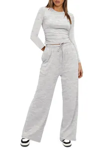 Detailed view of women's grey long sleeve top and high waist wide leg loungewear set
