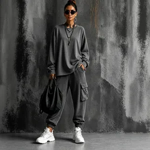 Model wearing women's charcoal gray oversized top and cargo jogger two-piece set