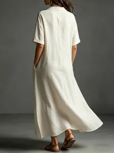 Back view of a loose minimalist beige cotton linen maxi dress for elegant summer commute