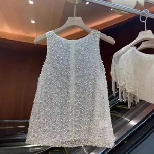 Luxurious elegant sleeveless vest with intricate pearl and sequin embellishments.