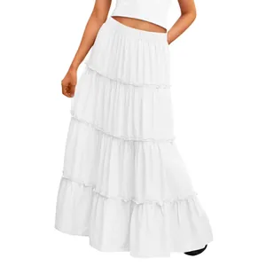 Side view of a white tiered maxi skirt featuring a comfortable elastic waistband detail