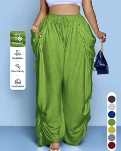 Detail van groene viscose harembroek met trekkoord in de taille en ademende stof