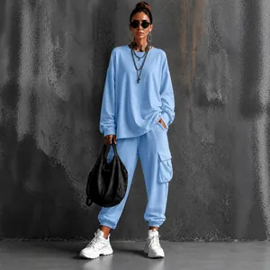 Street style two-piece casual set with light blue long-sleeve top and cargo pants