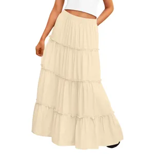 Detailed view of a cream tiered maxi cake skirt with high waist and layered design.