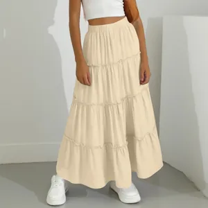 Detail of the elegant cream tiered maxi skirt showing the ruffled layers and fit