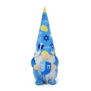Handmade plush Hanukkah gnome doll with a patterned blue hat and dreidel on white background.