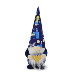 Front view of Hanukkah gnome doll with blue festive hat and golden menorah accessory