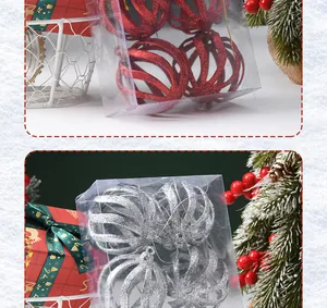 Primo piano di palline di Natale glitterate rosse e argento in scatola trasparente