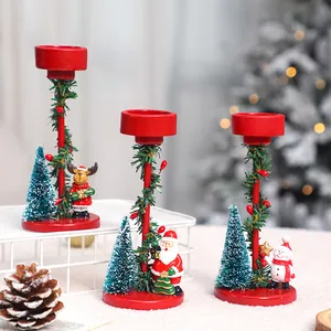 Set of three festive Christmas candle holders with Santa, snowman and reindeer ornaments