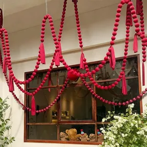 Festive wine red velvet ball garland hanging decoration with tassels for shop windows