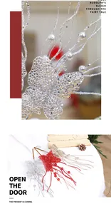 Macro detail showing silver glitter butterfly Christmas picks and red berry floral stems