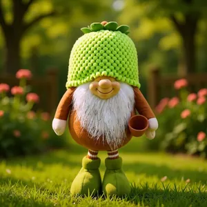 Handcrafted garden gnome doll with green knitted hat holding a small terracotta pot