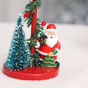 Festive European style Christmas candle holder with Santa Claus and mini tree ornament