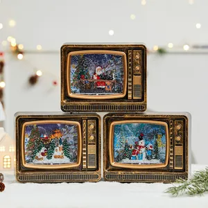 Set of three vintage-style Christmas television snow globes with festive Santa and snowman scenes