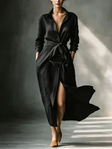 Elegant black maxi dress with waist tie and high slit detail, French style fashion.