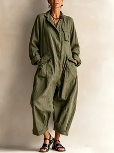 Detailed view of an olive green women's long-sleeve utility jumpsuit with wide legs