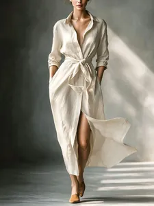 Elegant French style beige linen shirt dress with long sleeves and a tie-waist detail