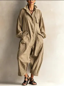 Full-length khaki utility jumpsuit featuring balloon sleeves and wide-leg design details