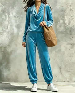 Detailed view of women's blue velvet leisure set with cowl neck top and joggers outfit