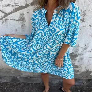 Detailed view of bohemian blue and white geometric print V-neck casual pleated dress