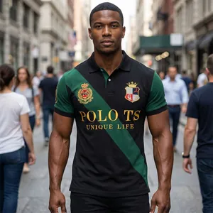 Detailed view of the embroidered crests and POLO TS text on a black and green polo shirt.