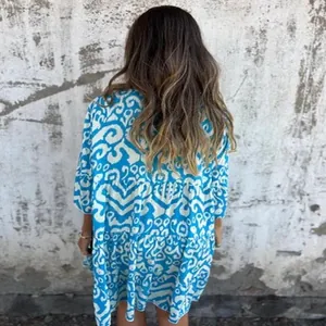 Detailed back view of a bohemian blue and white printed casual V-neck dress for women