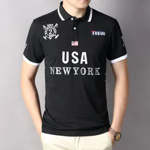 Detail of black cotton polo shirt featuring USA New York embroidery and premium texture