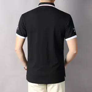 Back view of a black cotton polo shirt featuring NY sleeve embroidery and white trim