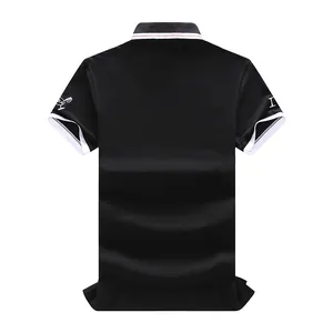 Back view of black golf polo shirt with embroidered sleeve detail and white tipping