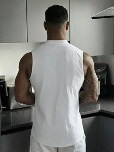 Close-up of the back view of a white sleeveless linen Henley shirt highlighting the texture