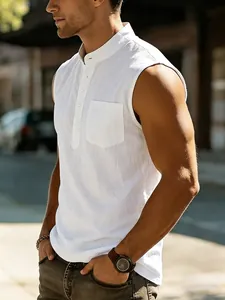 Close-up of a white sleeveless linen Henley shirt on a male model in sunlight