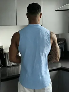 Rear view of a light blue sleeveless linen shirt showing fabric texture and fit