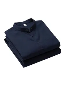 Close-up of folded navy blue linen Henley shirt showing stand-up collar and pocket
