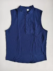 Detailed view of a navy blue linen sleeveless Henley shirt featuring a chest pocket