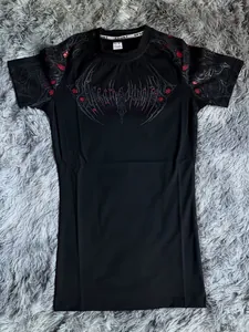 Detailed view of the gothic graphic print on this black athletic compression T-shirt for men
