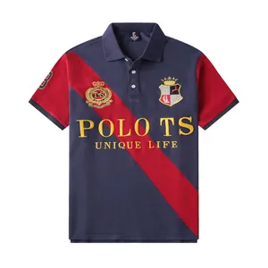 Detailed close-up of a men's navy and red patchwork polo shirt with crest embroidery