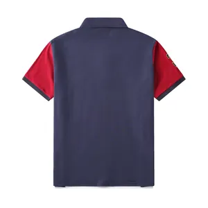 Back view of a men's color block sports polo shirt in navy blue and red cotton fabric