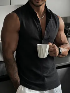 Close-up detail of black sleeveless linen Henley shirt for men in a modern kitchen setting