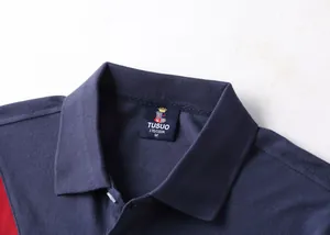 Close-up of navy blue men's polo shirt collar with TUSUO brand label details
