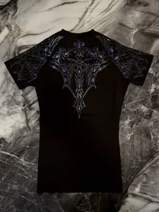 Detailed view of the intricate silver and purple tribal print on a black sports t-shirt