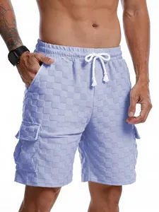 Detailed close-up of men's light blue checkerboard jacquard cargo shorts with textured fabric