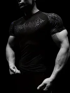 Close-up of men's athletic compression t-shirt featuring a stylized graphic print design