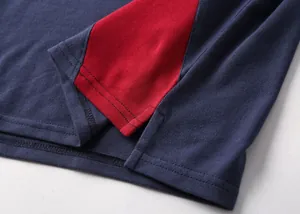 Detail shot of the side vent and pique fabric texture on this color-block Polo shirt