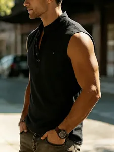 Detail view of the fit and fabric of a black sleeveless linen Henley shirt on model